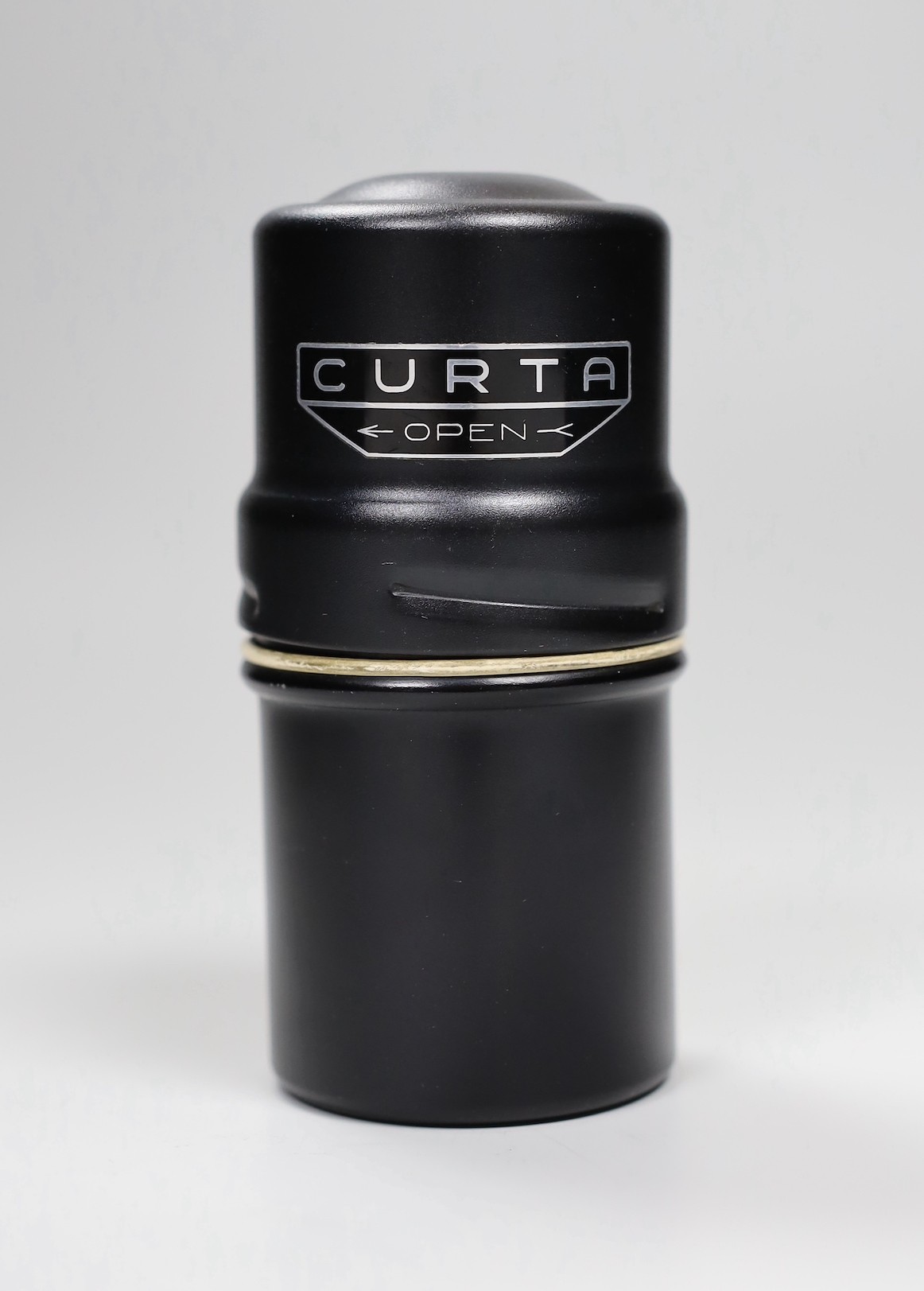 A Curta type 1 calculator, together with associated paperwork.